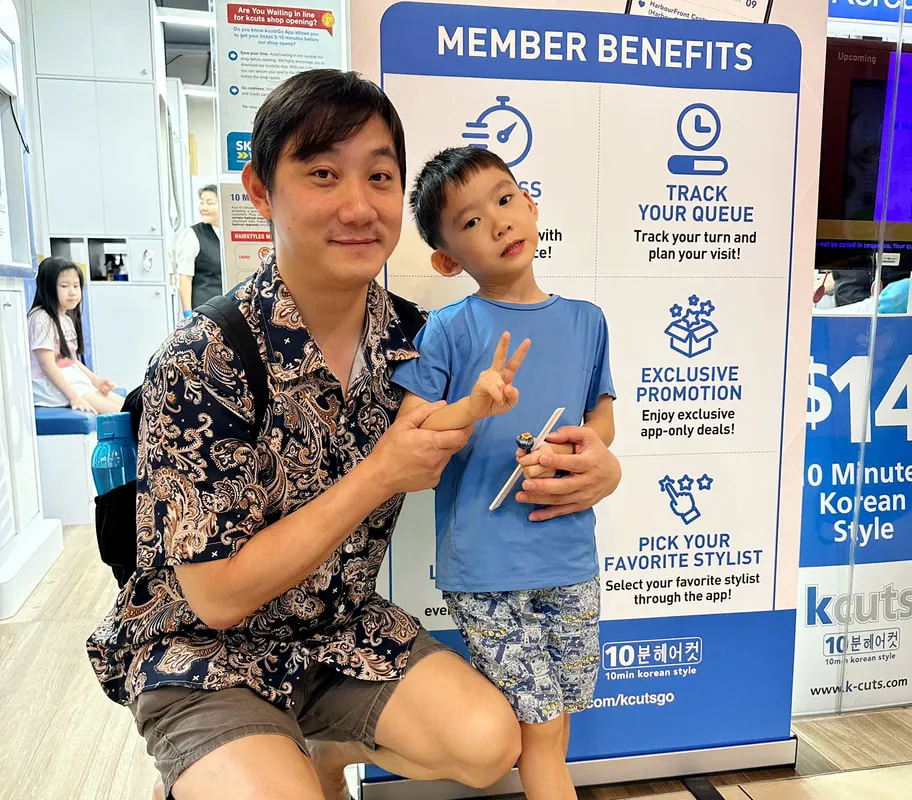A child after a haircut at kcuts